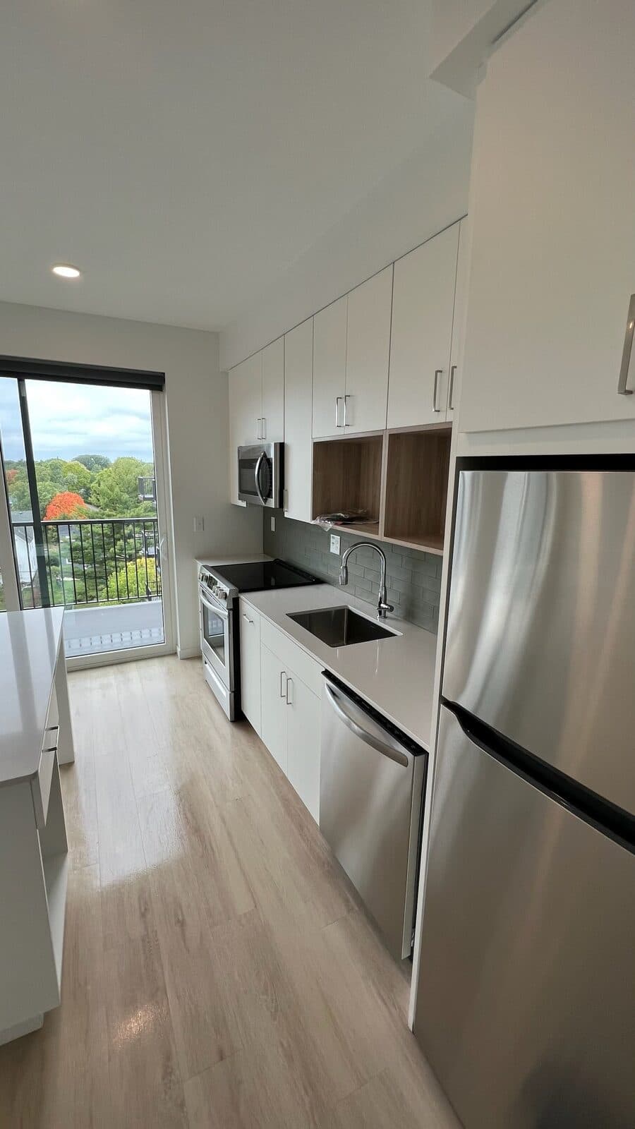 A freshly cleaned, move-in ready galley kitchen by Neat N Clean Co.