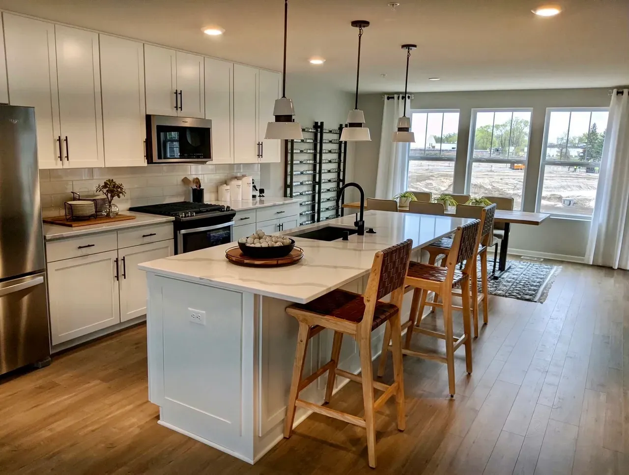 A bright, spotless open-concept kitchen cleaned by Neat N Clean Co.