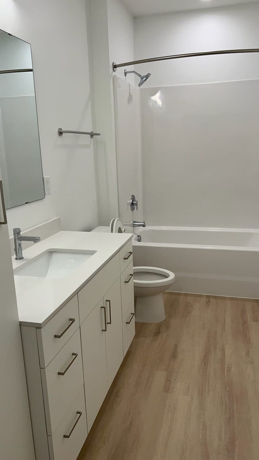 A detailed, spotless bathroom after a unit turnover clean